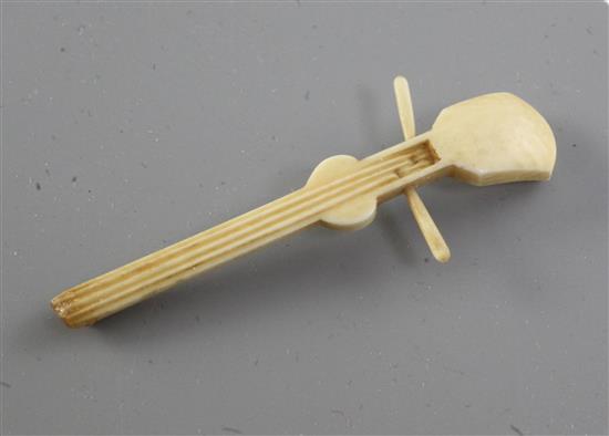 A Japanese ivory okimono of a kneeling musician, early 20th century, height 9.3cm, wood stand, damage to shamisen